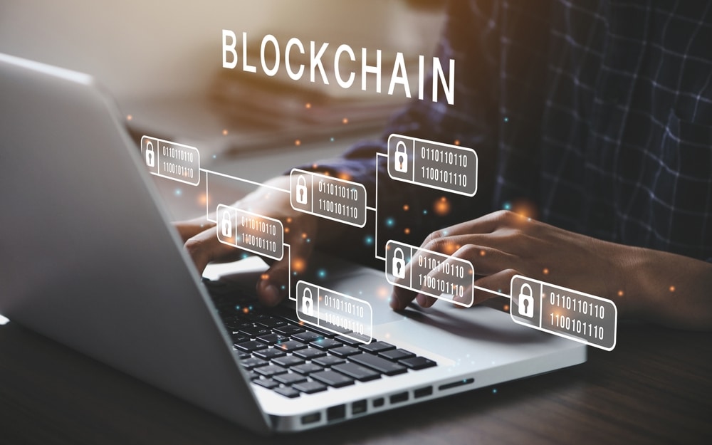 Businessman,Using,A,Computer,To,Blockchain,Technology,Concept,With,A