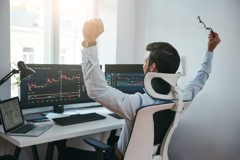 Yes!,Back,View,Of,Stock,Trader,With,Raised,Hands,Looking