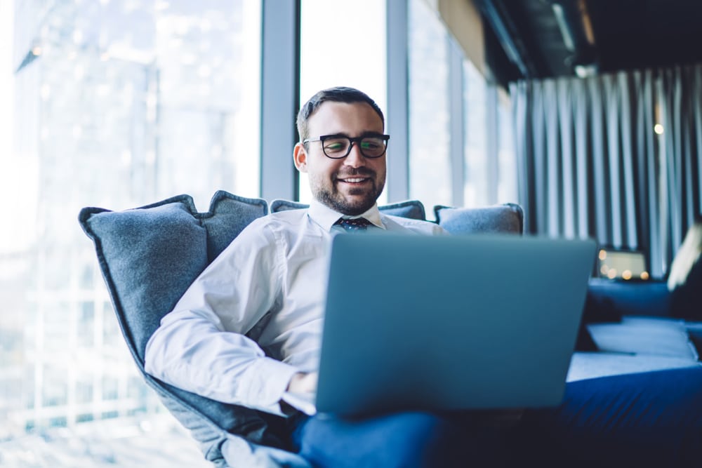 Happy,Smiling,Businessman,Having,Online,Conference,Via,Laptop,Computer,Sitting