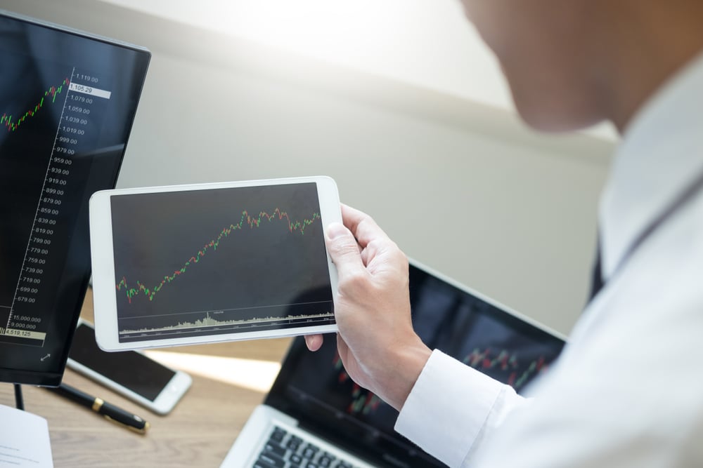 Financial,Broker,Looking,At,The,Statistics,Of,Stock,Exchange,And